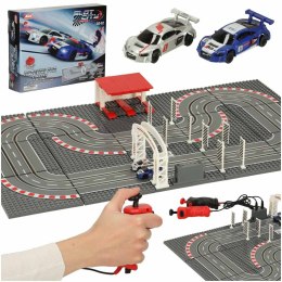 LEGO Tor wyścigowy samochodowy elektryczny policyjny 2 auta autka kontrolery zakręty klocki konstrukcyjne